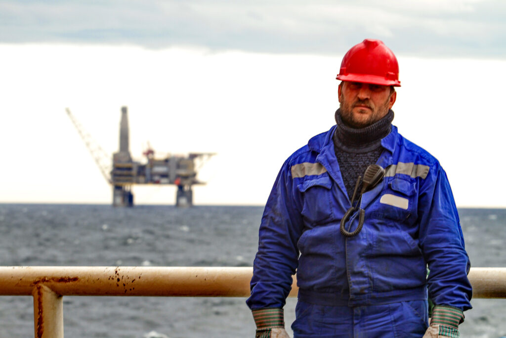 oilman shift workers deck ship background offshore oil shelf planforms work way work 1
